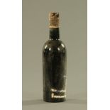 +/- A 75 cl bottle of Warre's vintage port 1960, lacking label and with seal damage.