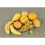 A collection of nine pieces of carved and stained alabaster models of fruits.