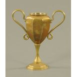 A Victorian brass two-handled trophy with liner, 25 cm high.