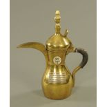 An eastern brass Dallah copper coffee pot,