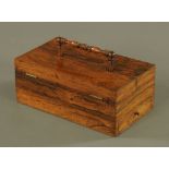 A Regency rosewood sewing box, with fine turned handle and twin lifting top,