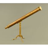 A brass telescope on tripod stand, no visible makers name. Length closed 116 cm.