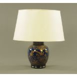 A 20th century ginger jar form electric table lamp decorated in gilt with flowers and repeating