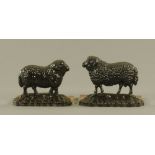 A matched pair of Victorian black painted cast iron sheep pattern door porters,