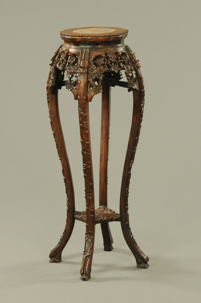 A 19th century Chinese hardwood rouge marble topped jardiniere stand,