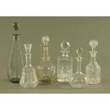 Six decanters, four cut glass, one moulded and one plain.