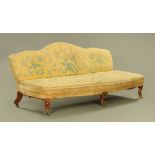 A fine Regency oak three seater settee, with shaped back and slightly bowed front,