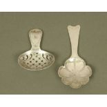 A George III silver caddy spoon, with feather engraved shaped floral bowl, London 1807,