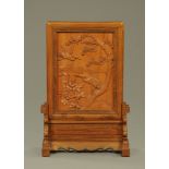 A Chinese hardwood table screen, carved with cranes. Height 75 cm, width 49 cm (see illustration).