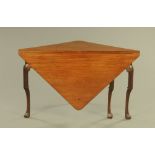 A George III figured mahogany square corner table, with single triangular drop leaf,