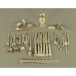 A collection of silver spoons, button hooks, Ricard bottle stops etc.