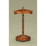 A Victorian mahogany bowfronted stick stand, with shaped frieze. Height 87 cm, depth 31 cm.