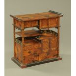 A Japanese parquetry and lacquered tabletop cabinet, raised on a later stand.