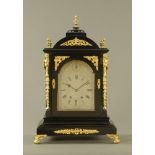 A large late Victorian ebonised three train spring driven bracket clock,