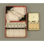 A boxed dessert set with embossed silver handles, hallmarked Sheffield 1930,