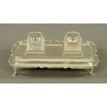 A George V silver rectangular two division ink stand of shaped outline by the Goldsmiths and