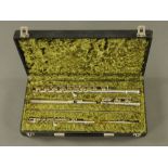 A cased flute, Yamaha YFL211S Nippon Gakki Company Limited Japan, together with a Hsinghai piccolo.