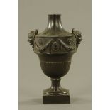 A 19th century Turner carved black basalt two handled urn of Neo-Classical design,