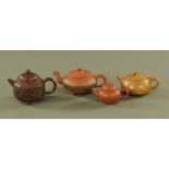 Four Chinese Yixing teapots, one with dragon head modelled spout,