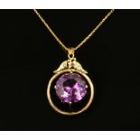 A 14 ct gold Alexandrite pendant and chain, synthetic stone. 8.5 grams gross.