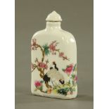 A Chinese opium bottle, polychrome, decorated with birds, blossom and branches. Height 9 cm.
