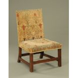 A George III oak square back dining chair upholstered in a pale green patterned material and raised