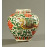 A Chinese Wucai famille verte porcelain vase, painted with Fenghuang,