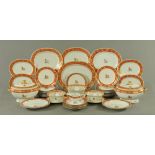 An extensive Chinese Qianlong armorial porcelain dinner service, decorated in red,