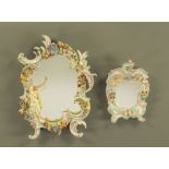 An early 20th century Dresden floral encrusted porcelain dressing table mirror of rococo design,