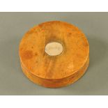 An early 19th century fruitwood circular lidded box,