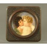 A 19th century Ware plaque, decorated with cherubs housed in an oak frame,