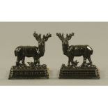 A pair of Victorian black painted cast iron stag pattern door porters later mounted to wooden