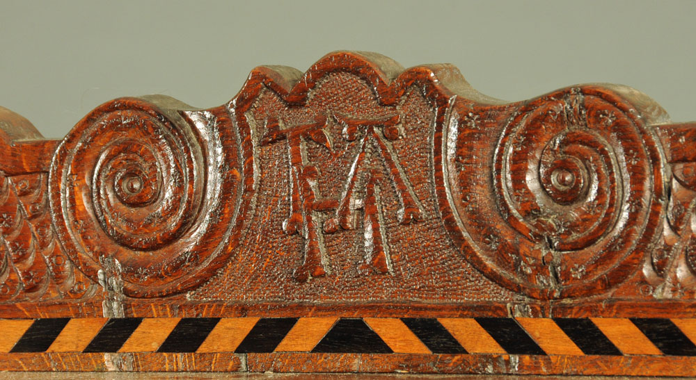 A Victorian carved oak settle, decorated with floral, armorial and religious panels, - Image 9 of 15