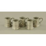 A set of five 19th century pewter glass bottomed tankards by Watts & Harton,