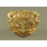 A Chinese carved jade buckle. Width 9 cm.