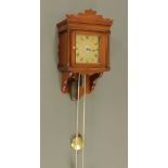 A late 18th century single handed hooded alarm wall timepiece, case height 57 cm, width 32 cm,