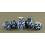 Five Chinese ginger jars and vases, each in prunus pattern. Largest height 20 cm.