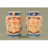A pair of Imari vases, decorated in typical colours. Height 25 cm.