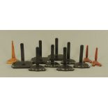 Eleven wooden plate stands, comprising three matching ebonised wooden stands,