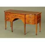 A George III mahogany breakfront sideboard, with reeded edge, crossbandings and boxwood stringings,