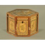 An early 19th century inlaid pine hexagonal tea caddy,