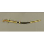 A 19th century Egyptian cavalry sabre, with horn grip and brass hilt,