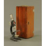 A student's monocular microscope by ESL, with objective the same, 20 cm high, with mahogany case.