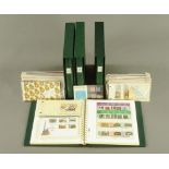 Four albums of mint Isle of Man stamps, and a box of First Day Covers and mint stamp books.