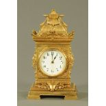 A brass cased French mantle clock, with single train spring driven movement.