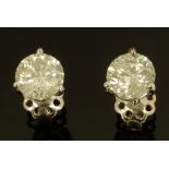 A pair of 18 ct white gold stud earrings, set with diamonds weighing +/- 3.