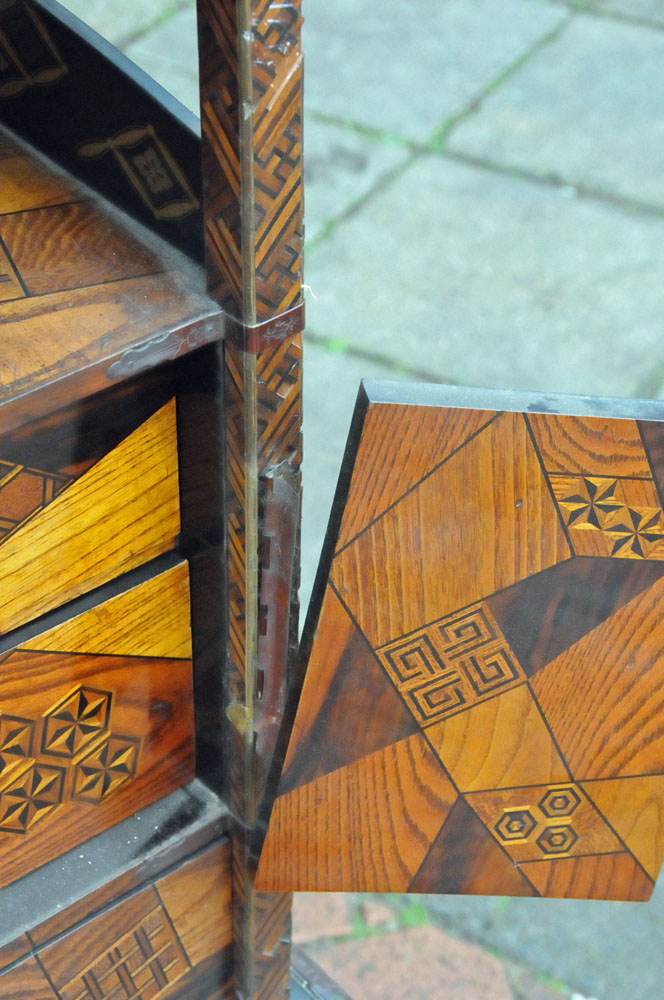 A Japanese parquetry and lacquered tabletop cabinet, raised on a later stand. - Image 7 of 15