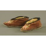 A pair of early 20th Chinese century embroidered silk shoes for bound feet,