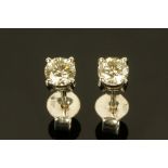 A pair of 18 ct white gold stud earrings, set with diamonds weighing +/- .63 carats.