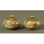 A pair of Japanese Satsuma ware squat vases, well painted with panels of figures and insects,